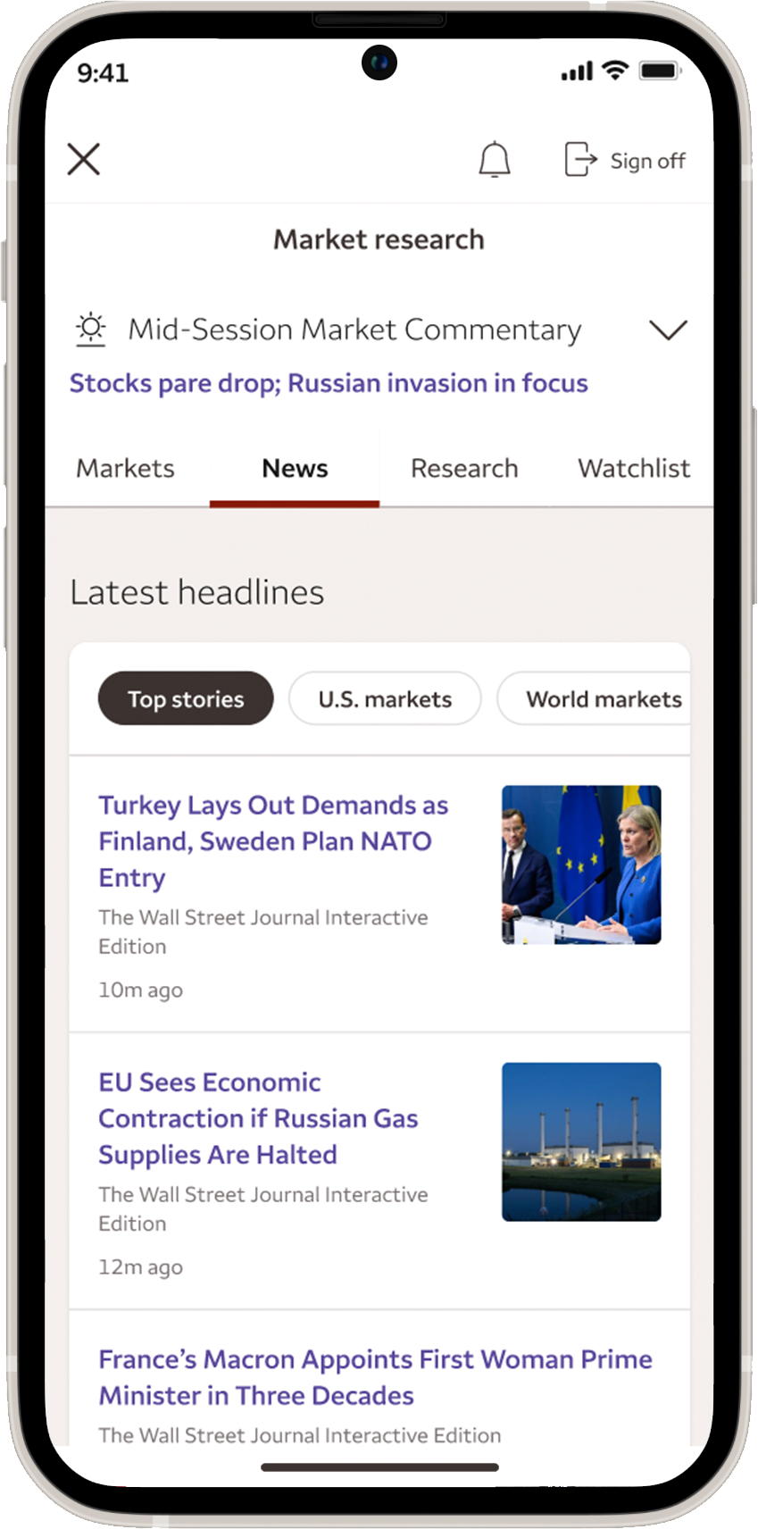 Mobile phone showing the Wells Fargo Mobile app Market research news screen